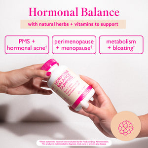 Amy Suzanne Hormone Balance Gummies being passed between two hands. Hormonal balance with natural herbs and vitamins. PMS + hormonal acne support, perimenopause + menopause, metabolism + bloating support.